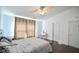 Well-lit bedroom boasts a comfortable bed, stylish vanity, and soothing ambiance for restful nights at 9718 Jupiter Pass, Carmel, IN 46032