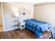 Comfortable bedroom with a classic color scheme and hardwood floors, offering a cozy retreat at 9718 Jupiter Pass, Carmel, IN 46032