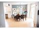 Spacious dining room with modern lighting, dining table and access to the kitchen and back patio at 9718 Jupiter Pass, Carmel, IN 46032