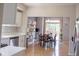 Bright dining area with hardwood floors and a sliding glass door to the outdoor deck at 9718 Jupiter Pass, Carmel, IN 46032