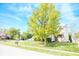 Exterior of a charming home with a manicured lawn, tree, and a brick and siding facade at 9718 Jupiter Pass, Carmel, IN 46032