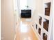 Hallway featuring built-in shelving, offering stylish storage solutions for an organized and clutter-free home at 9718 Jupiter Pass, Carmel, IN 46032