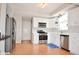 Well-lit kitchen with stainless steel appliances, white cabinetry and bright natural light at 9718 Jupiter Pass, Carmel, IN 46032