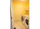 Functional laundry room with modern appliances and bright walls, making laundry chores a breeze at 9718 Jupiter Pass, Carmel, IN 46032