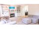 Comfortable living room with a fireplace, built-in shelving, and neutral color scheme at 9718 Jupiter Pass, Carmel, IN 46032