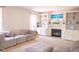 Inviting living room featuring a plush couch, fireplace, and built-in shelving for a cozy and organized space at 9718 Jupiter Pass, Carmel, IN 46032