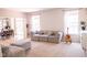 Bright living room showcases a comfortable sectional sofa and neutral tones, creating a relaxing atmosphere at 9718 Jupiter Pass, Carmel, IN 46032