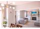 Cozy living room with a fireplace, built-in shelving, and comfortable seating area at 9718 Jupiter Pass, Carmel, IN 46032