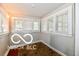 Bright sunroom with many windows and hardwood floors at 1014 W 32Nd St, Indianapolis, IN 46208