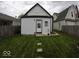 This backyard features a lush lawn and an accessory dwelling unit in the rear at 1035 Albany St, Indianapolis, IN 46203