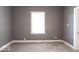 Neutral carpeted bedroom with neutral paint and natural light at 1035 Albany St, Indianapolis, IN 46203