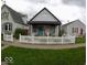 Exterior shot of a cute house with a white picket fence surrounding the front yard at 1035 Albany St, Indianapolis, IN 46203