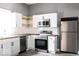Modern kitchen featuring stainless steel appliances and butcher block countertops with white cabinets at 1035 Albany St, Indianapolis, IN 46203