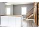 Bright living space with hardwood floors, modern paint, custom stairs, and a modern island at 1035 Albany St, Indianapolis, IN 46203