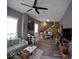 The living room is brightly lit with vinyl flooring and open staircase to a loft at 1035 Albany St, Indianapolis, IN 46203