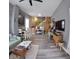 The living room is brightly lit with vinyl flooring and open staircase to a loft at 1035 Albany St, Indianapolis, IN 46203