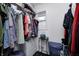 Walk-in closet features ample storage with clothing racks, drawers, and a window at 10805 Charlemagne Dr, Indianapolis, IN 46259