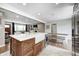 Modern kitchen with an island, stainless steel appliances and flows into the living room with lots of natural light at 10805 Charlemagne Dr, Indianapolis, IN 46259