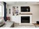 Stylish living room with fireplace and built-in shelving and lots of natural light at 10805 Charlemagne Dr, Indianapolis, IN 46259