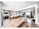 Bright, open concept kitchen flows into the living room with hardwood floors and ample natural light at 10805 Charlemagne Dr, Indianapolis, IN 46259