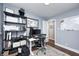 Functional home office with a modern desk, shelving, and a bulletin board with hardwood floors at 10805 Charlemagne Dr, Indianapolis, IN 46259