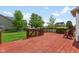 Expansive wooden deck, complete with gated access, provides serene backyard views, ideal for relaxing and entertaining at 1105 Wild Ridge Blvd, Brownsburg, IN 46112