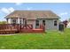Backyard featuring a multi-level deck and lush green lawn, perfect for outdoor gatherings at 1105 Wild Ridge Blvd, Brownsburg, IN 46112