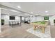 Spacious finished basement with laminate flooring and recreational features, great for entertaining at 1105 Wild Ridge Blvd, Brownsburg, IN 46112