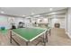 Finished basement with laminate flooring and recreational features, great for entertaining at 1105 Wild Ridge Blvd, Brownsburg, IN 46112