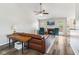Spacious living room with a fireplace, ceiling fan and comfortable seating at 1105 Wild Ridge Blvd, Brownsburg, IN 46112