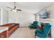 Bright living room featuring a fireplace, ceiling fan, and comfortable seating at 1105 Wild Ridge Blvd, Brownsburg, IN 46112