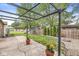 Landscaped backyard featuring a pergola, play set, and gravel fire pit area at 1106 Fox Trail W Dr, New Palestine, IN 46163