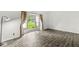 Well-lit bedroom with hardwood floors and a large window with a view of the yard at 1106 Fox Trail W Dr, New Palestine, IN 46163