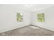 Bright bedroom with carpeting, neutral walls, and natural light from windows overlooking the front yard at 1106 Fox Trail W Dr, New Palestine, IN 46163