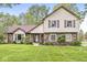 Charming two-story home with a well-manicured lawn and brick accents at 1106 Fox Trail W Dr, New Palestine, IN 46163