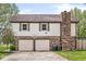 Two-car garage and basketball hoop at 1106 Fox Trail W Dr, New Palestine, IN 46163