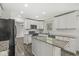 Well-lit kitchen featuring granite counters, stainless appliances and a center island at 1106 Fox Trail W Dr, New Palestine, IN 46163