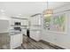 Bright kitchen with white cabinetry, granite countertops, and stainless appliances at 1106 Fox Trail W Dr, New Palestine, IN 46163