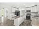 Bright kitchen offers white cabinetry, granite countertops and stainless steel appliances at 1106 Fox Trail W Dr, New Palestine, IN 46163