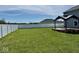 Expansive backyard features a white privacy fence and a deck with a pergola at 1112 W Nature Pointe Ln, Muncie, IN 47304
