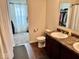 Bathroom featuring a double sink with a view into an adjoining closet at 1112 W Nature Pointe Ln, Muncie, IN 47304