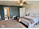 Comfortable bedroom featuring neutral color scheme, carpet flooring, and easy access to an ensuite bathroom at 1112 W Nature Pointe Ln, Muncie, IN 47304