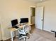 Bedroom with a desk setup for work and neutral-toned walls and carpet at 1112 W Nature Pointe Ln, Muncie, IN 47304