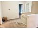 Carpeted hallway on an upper level, with doors leading to separate rooms at 1112 W Nature Pointe Ln, Muncie, IN 47304