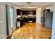 Well-lit kitchen boasting dark wood cabinets, stainless appliances, and an adjacent breakfast area at 1112 W Nature Pointe Ln, Muncie, IN 47304