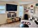 Recreation room with a large screen TV, and sports memorabilia on the wall at 1112 W Nature Pointe Ln, Muncie, IN 47304