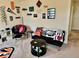 Recreation room with a loveseat, a novelty chair, and sports memorabilia on the wall at 1112 W Nature Pointe Ln, Muncie, IN 47304