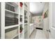 A bathroom with white cabinets, a light beige wall, and a playful shower curtain with colorful accents at 11121 Godfrey Dr, Noblesville, IN 46060