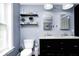 Bathroom features double sinks, ample lighting, and bright, neutral wall color at 11121 Godfrey Dr, Noblesville, IN 46060
