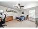 This bedroom features neutral walls, a ceiling fan, and a cozy bed with a plush blue blanket at 11121 Godfrey Dr, Noblesville, IN 46060